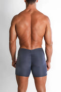 Dark gray form-fitting athletic bike shorts with ruched back design for enhanced fit and comfort