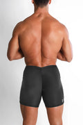 Black lustrous scrunch-butt 4.5 inch bike shorts with sleek form-fitting design and subtle side seam detailing