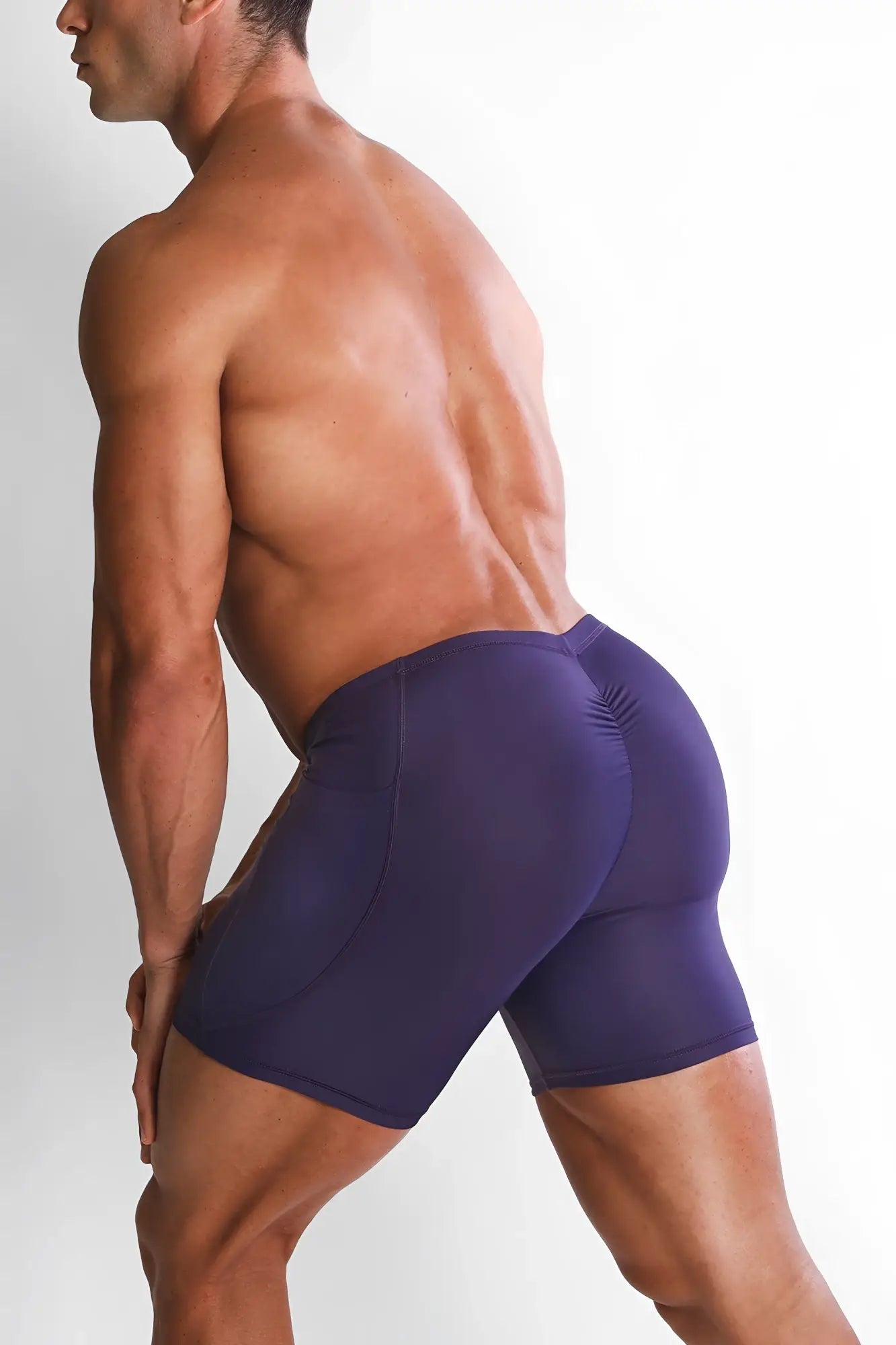 Purple lustrous scrunch-butt 4.5 inch bike shorts with sleek form-fitting design and subtle back seam texturing
