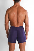 Purple lustrous scrunch-butt 4.5 inch bike shorts with snug fit and elastic waistband shown from the back side