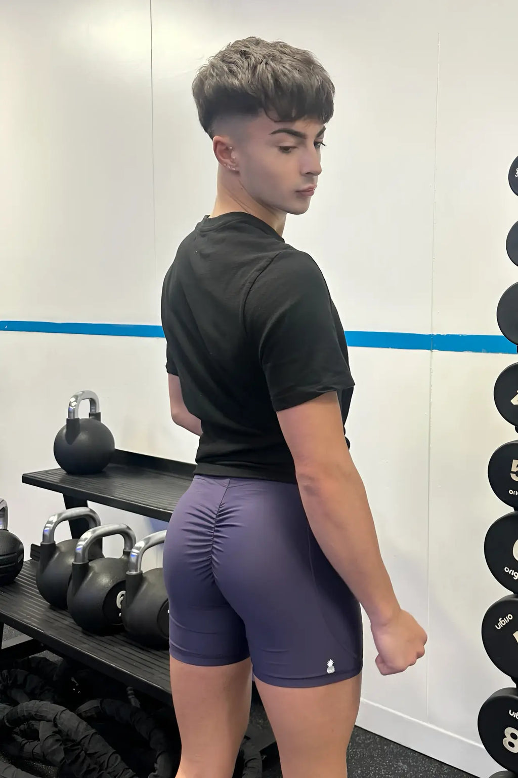 Purple lustrous scrunch-butt 4.5 inch bike shorts with ruched design and white logo on lower right leg
