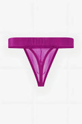A vibrant magenta adonis brand thong made of sheer mesh with a solid elastic waistband in luxe mesh purple persuasion thong