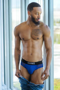 Blue adonis luxe royal blue briefs with a black waistband featuring white lettering for comfortable everyday wear