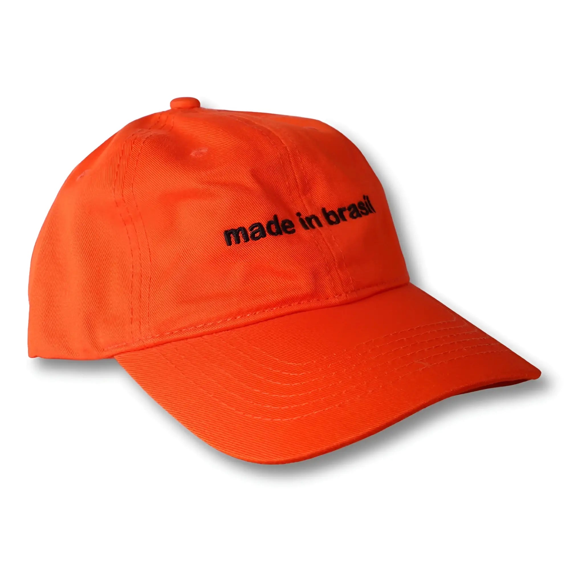 Bright orange cotton dad hat with black embroidered made in brazil text on the front