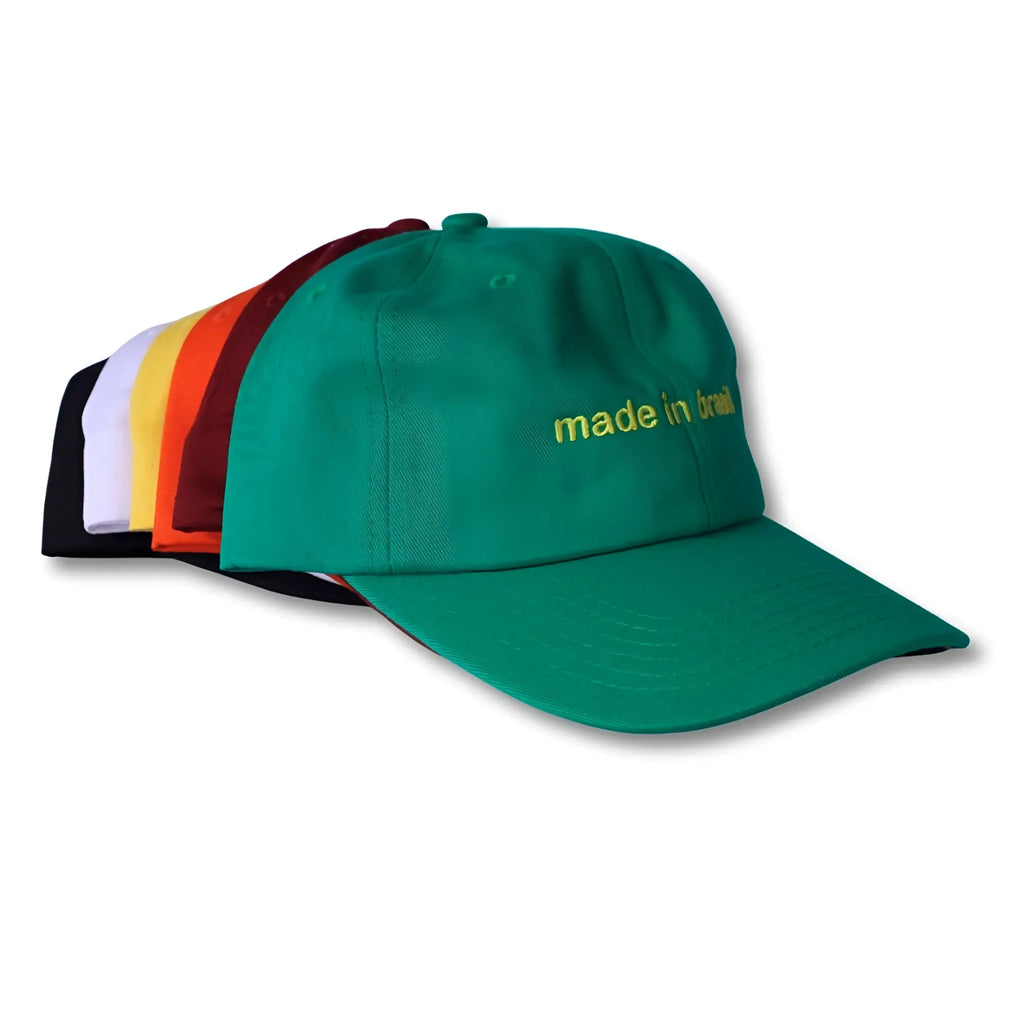 Green dad hat with gold embroidered made in brazil text highlighting its casual style and quality design
