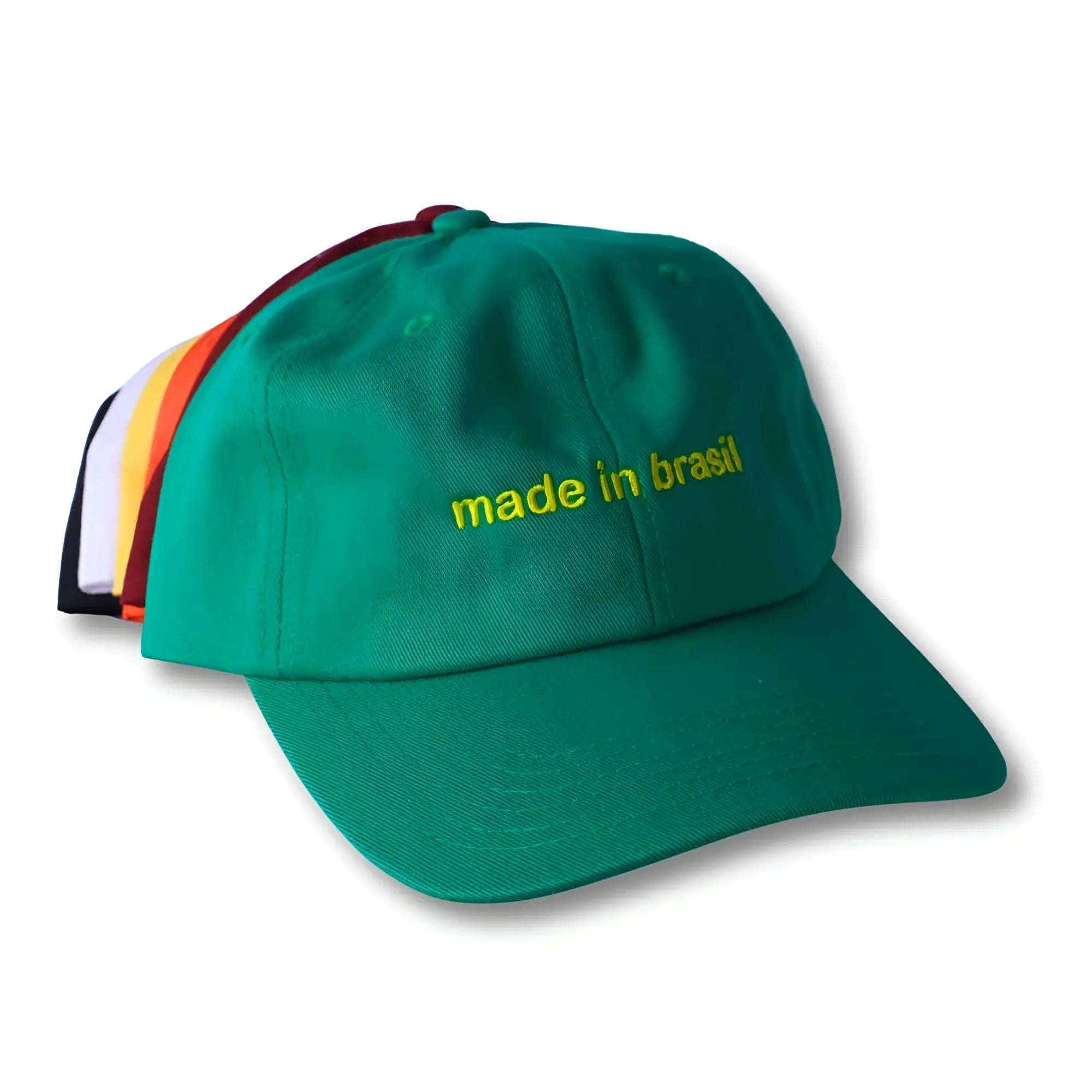 Green dad hat with yellow embroidered made in brazil text featuring adjustable back strap
