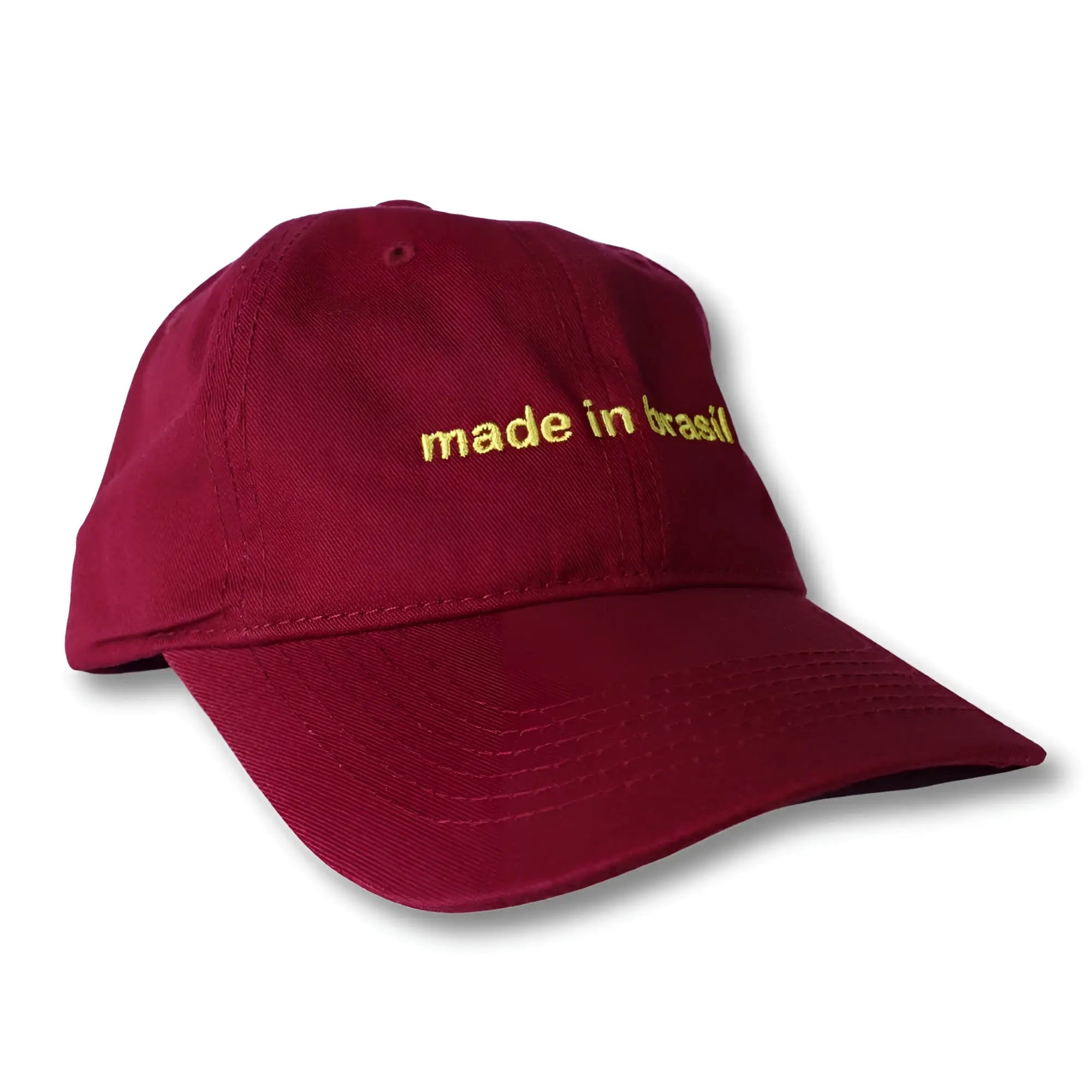 Maroon dad hat with gold embroidered made in brazil text on front panel perfect for casual wear