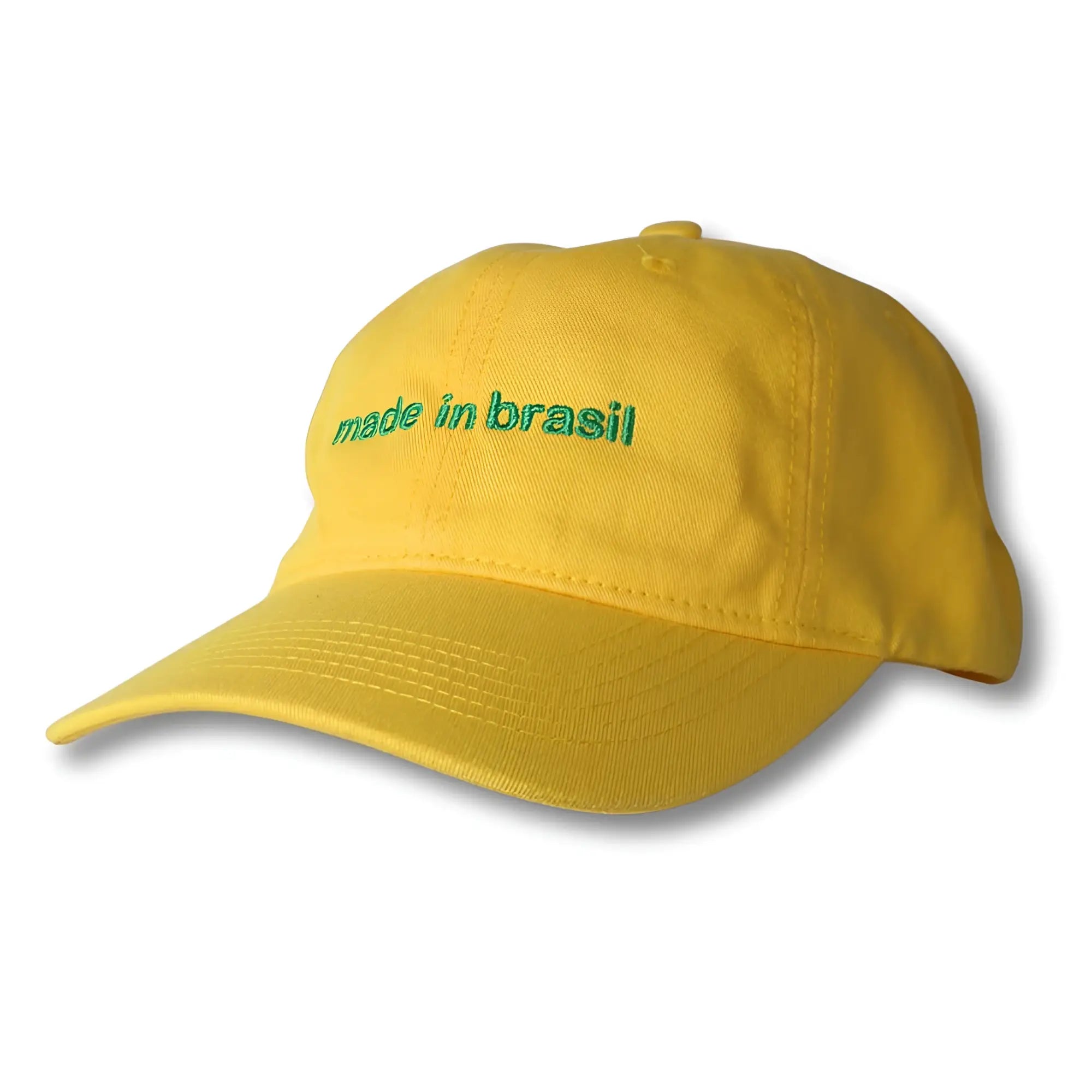 A vibrant yellow dad hat with green embroidered made in brazil text on the front made in brasil product