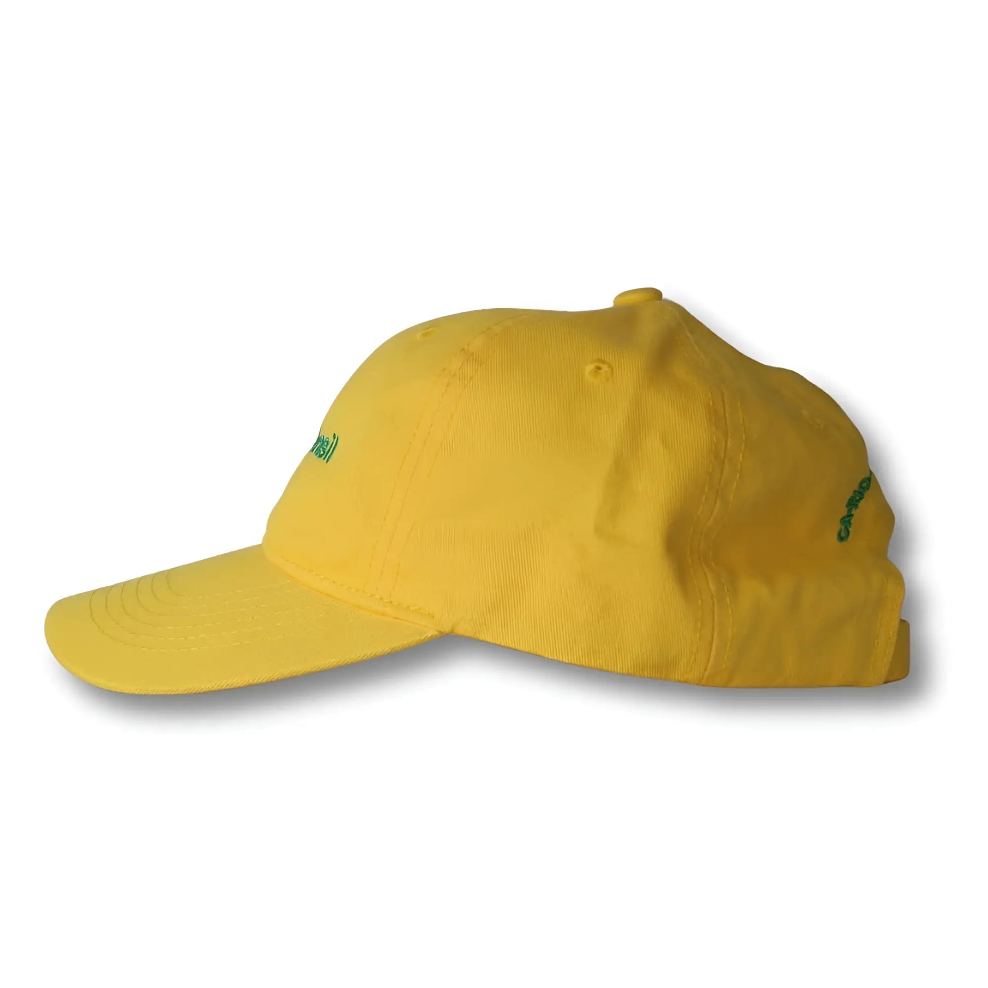 A vibrant yellow dad hat made in Brasil with subtle green embroidered text on the front and side