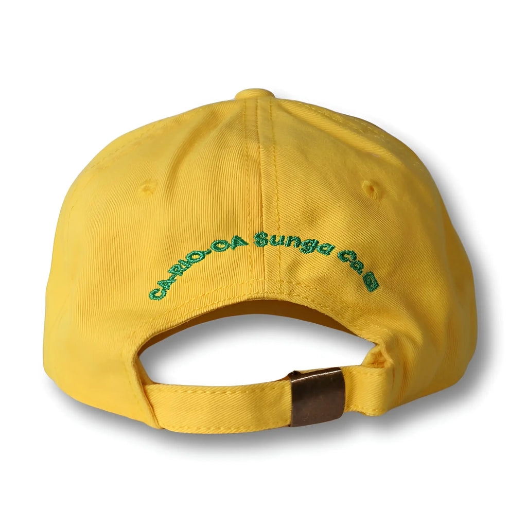 Back view of yellow cotton dad hat with green embroidery and brown leather tab made in brasil