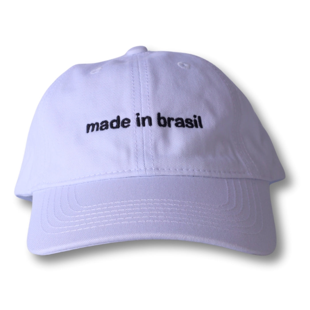 White dad hat with black embroidered made in brasil text front view casual baseball cap