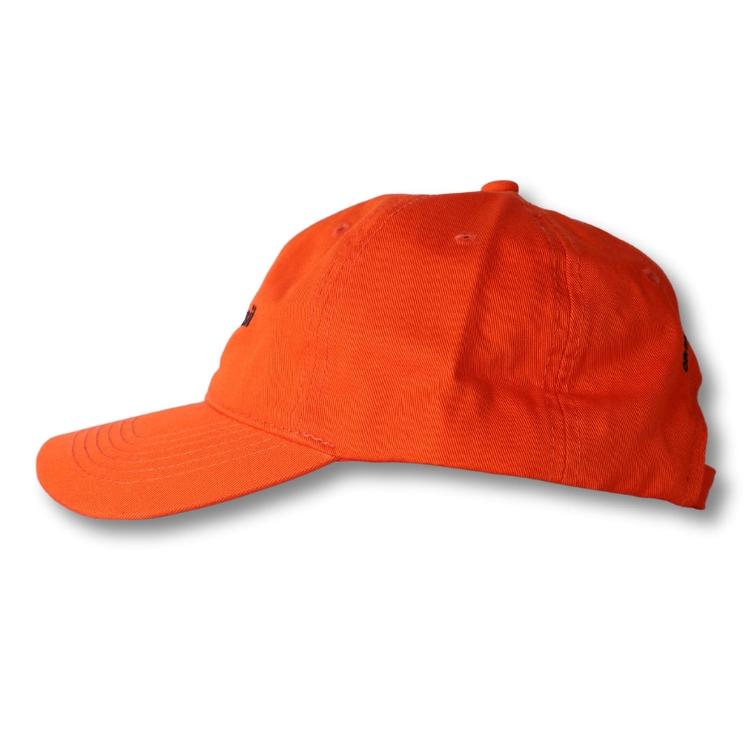 Bright orange cotton dad hat made in Brasil with curved brim and subtle black embroidered logo on the side