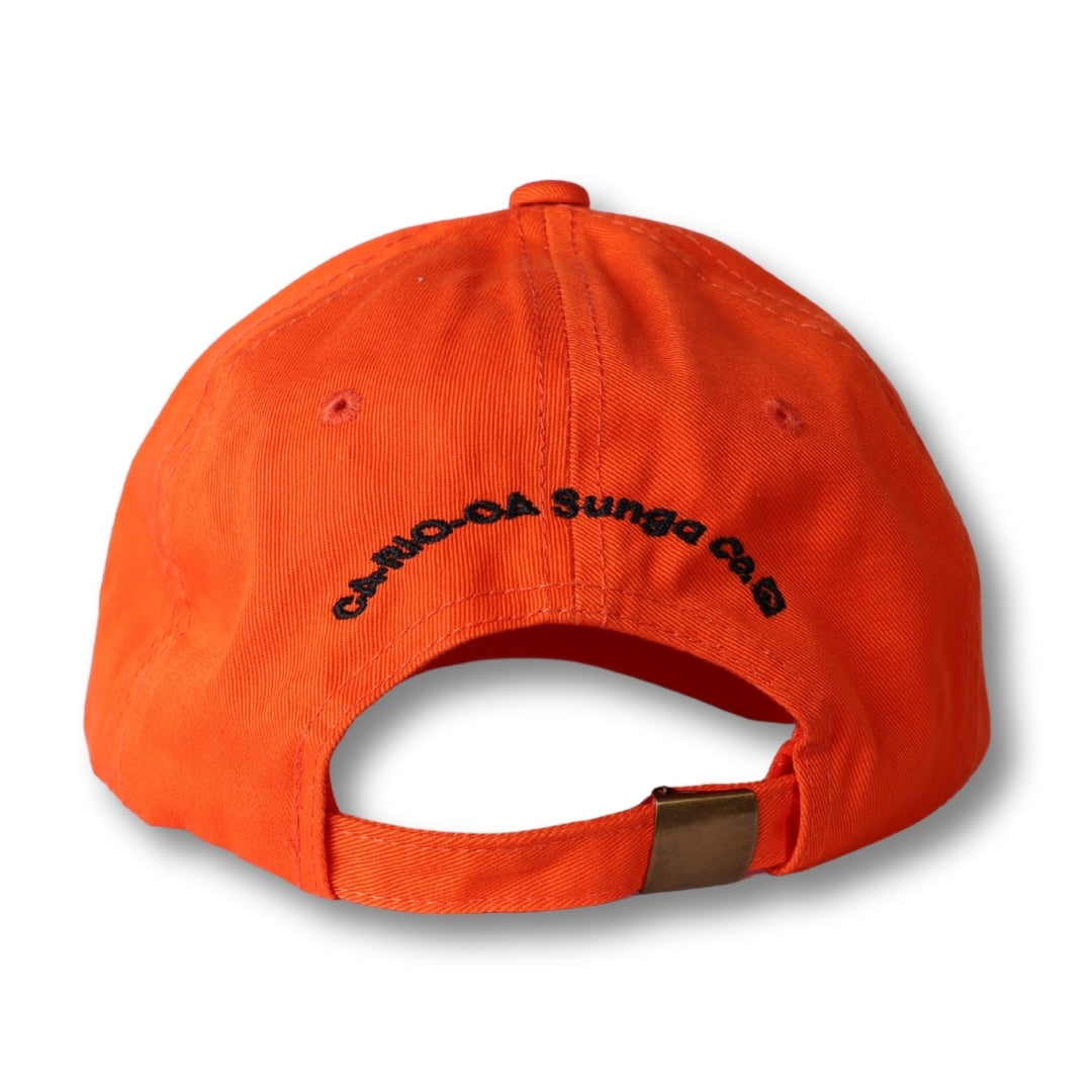 Bright orange made in brasil dad hat with black embroidered text and metallic buckle on the back side
