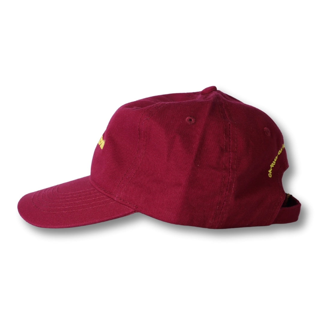 Maroon corduroy dad hat made in brasil with yellow embroidered text on the side