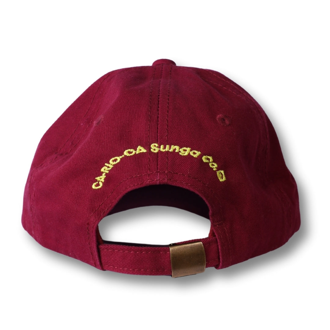Maroon cotton dad hat with gold embroidered carlo-da sungaa co text and brass metal buckle made in Brasil
