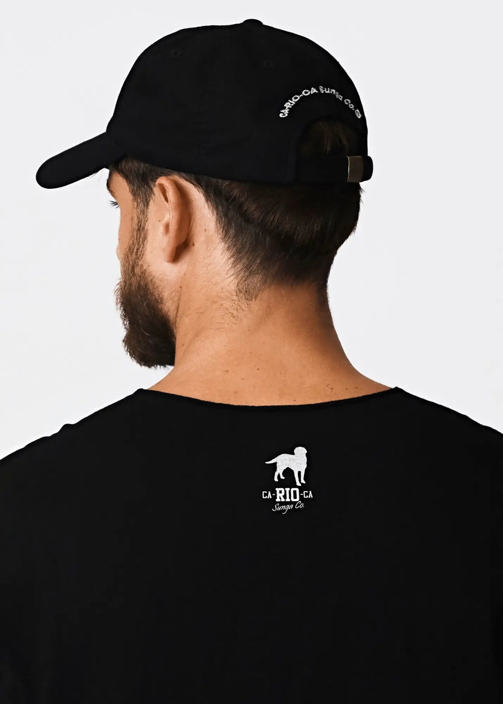 Black baseball cap with white embroidered text and logo on the back paired with made in rio mens cotton sleeveless t-shirt