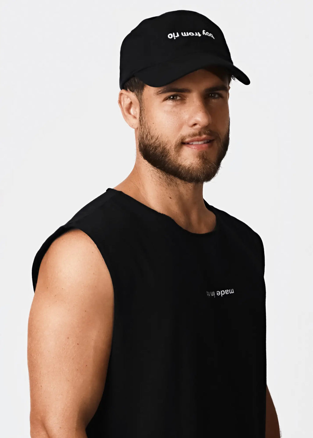 Black baseball cap with white embroidered boy more text paired with made in rio flip men’s black cotton sleeveless t-shirt