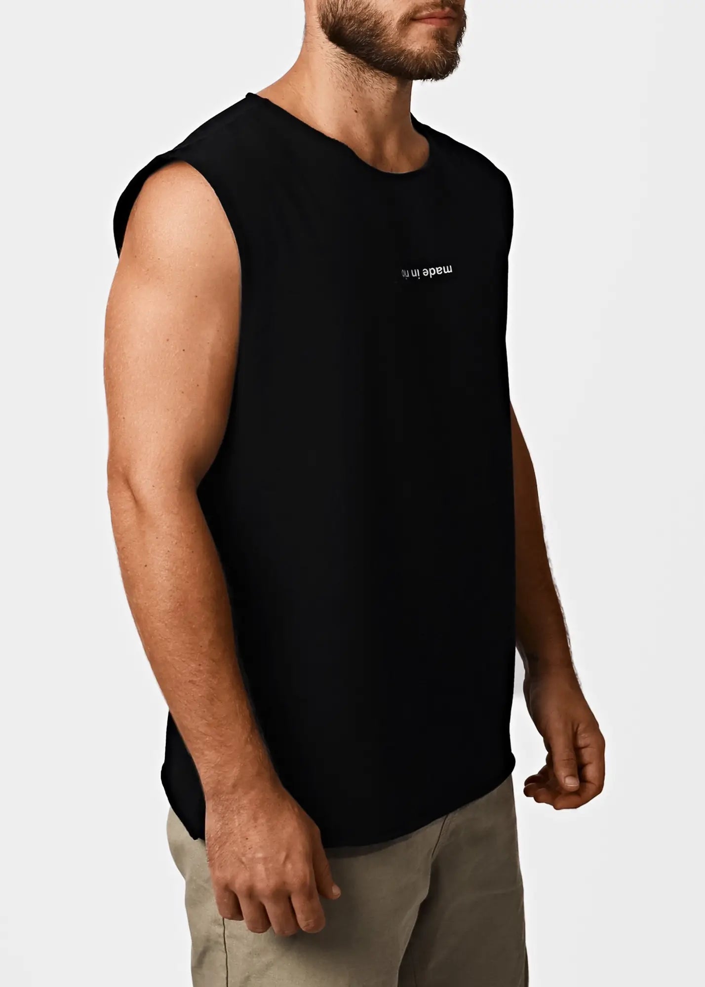 Black men’s cotton sleeveless t-shirt with subtle white made in text logo on chest for casual wear