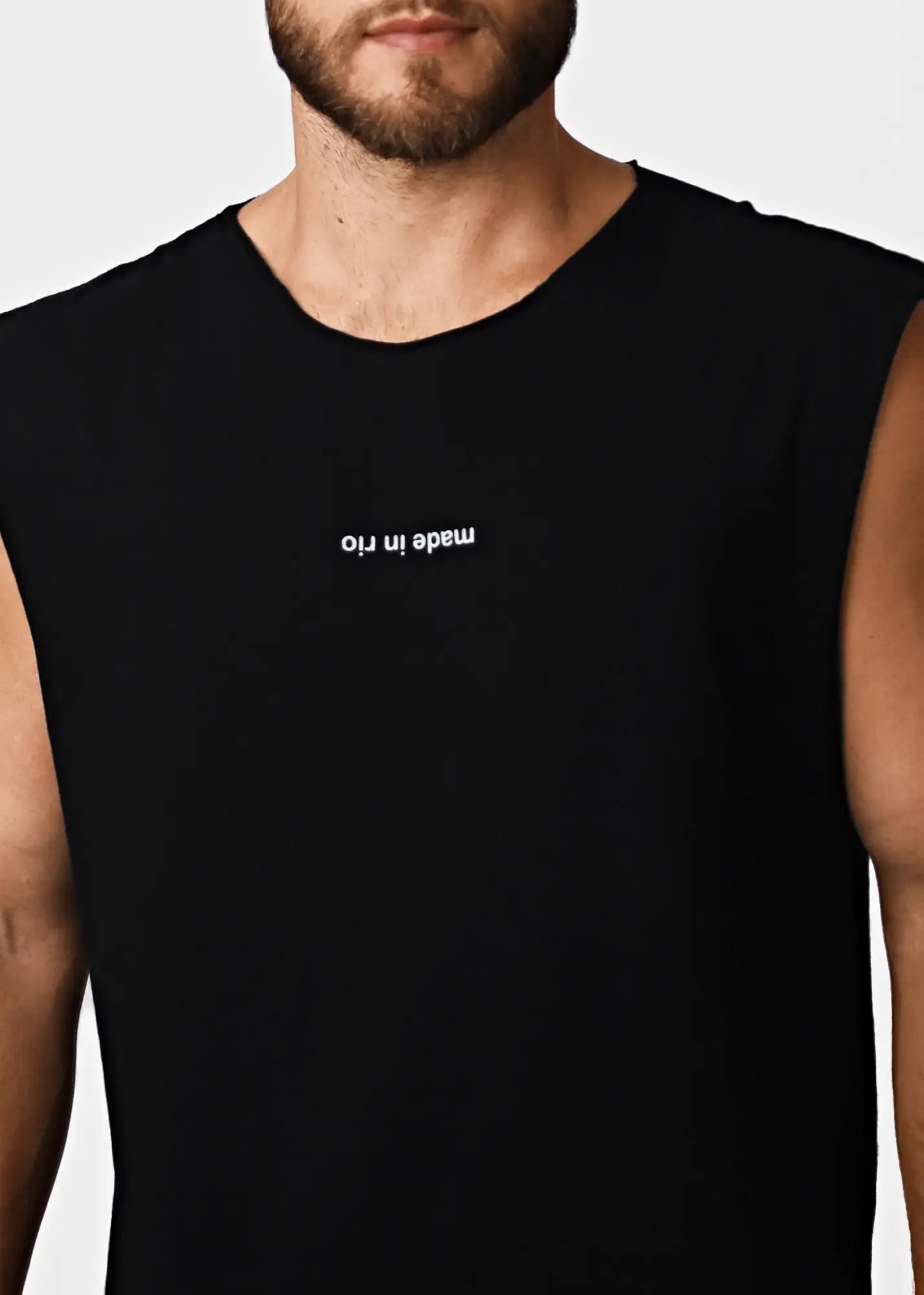 Black cotton sleeveless tank top with white embroidered made in rio text across the chest for men
