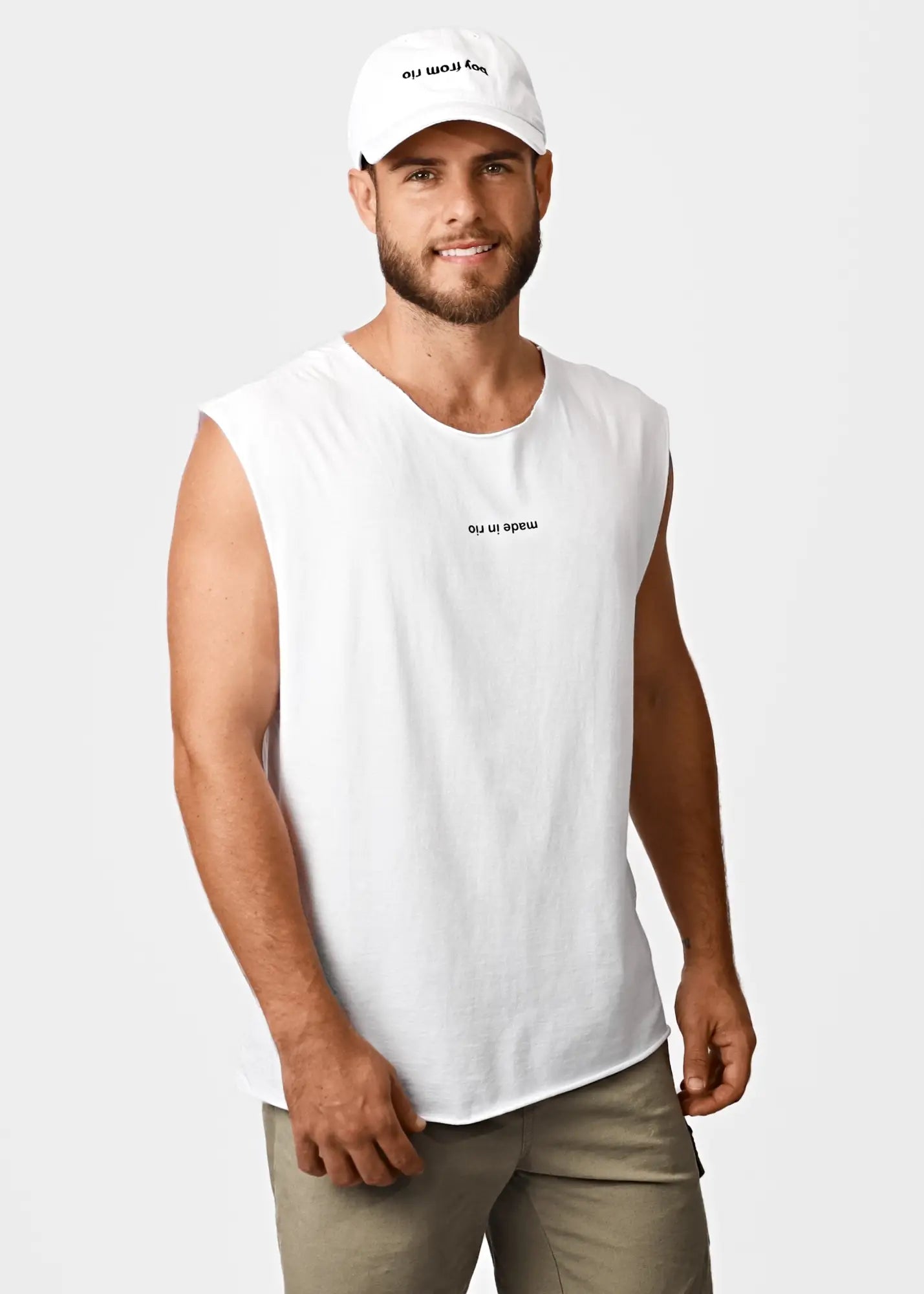 White cotton sleeveless tank top with subtle black text on chest and cap made in rio men’s t-shirt