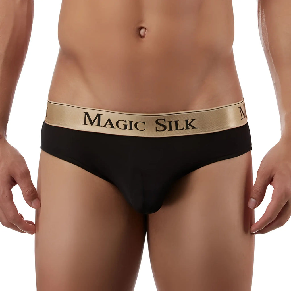 Black magic silk knit lo rise bikini underwear for men in black with gold waistband and black brand lettering size m