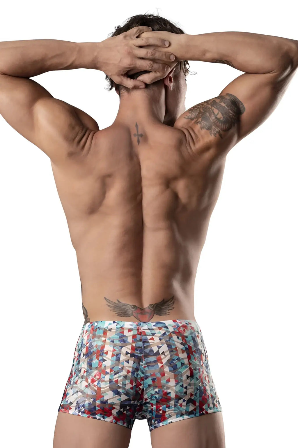 The man is wearing male power 131-293 colorful geometric pouch shorts in red white and blue with triangular designs