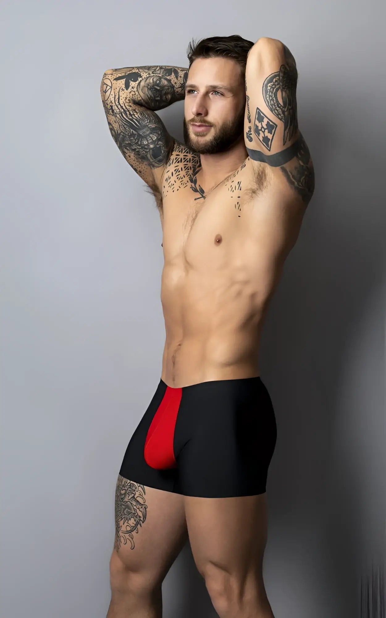 Black briefs with bold red mesh side panel and hot mesh pouch designed for comfort by Male Power