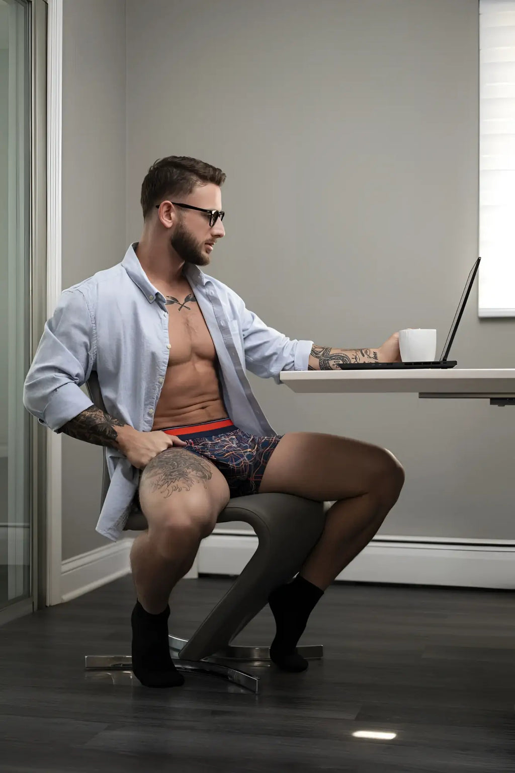 Man wearing male power 160-299 soo cumfy navy-orange boxer briefs with red waistband and patterned fabric