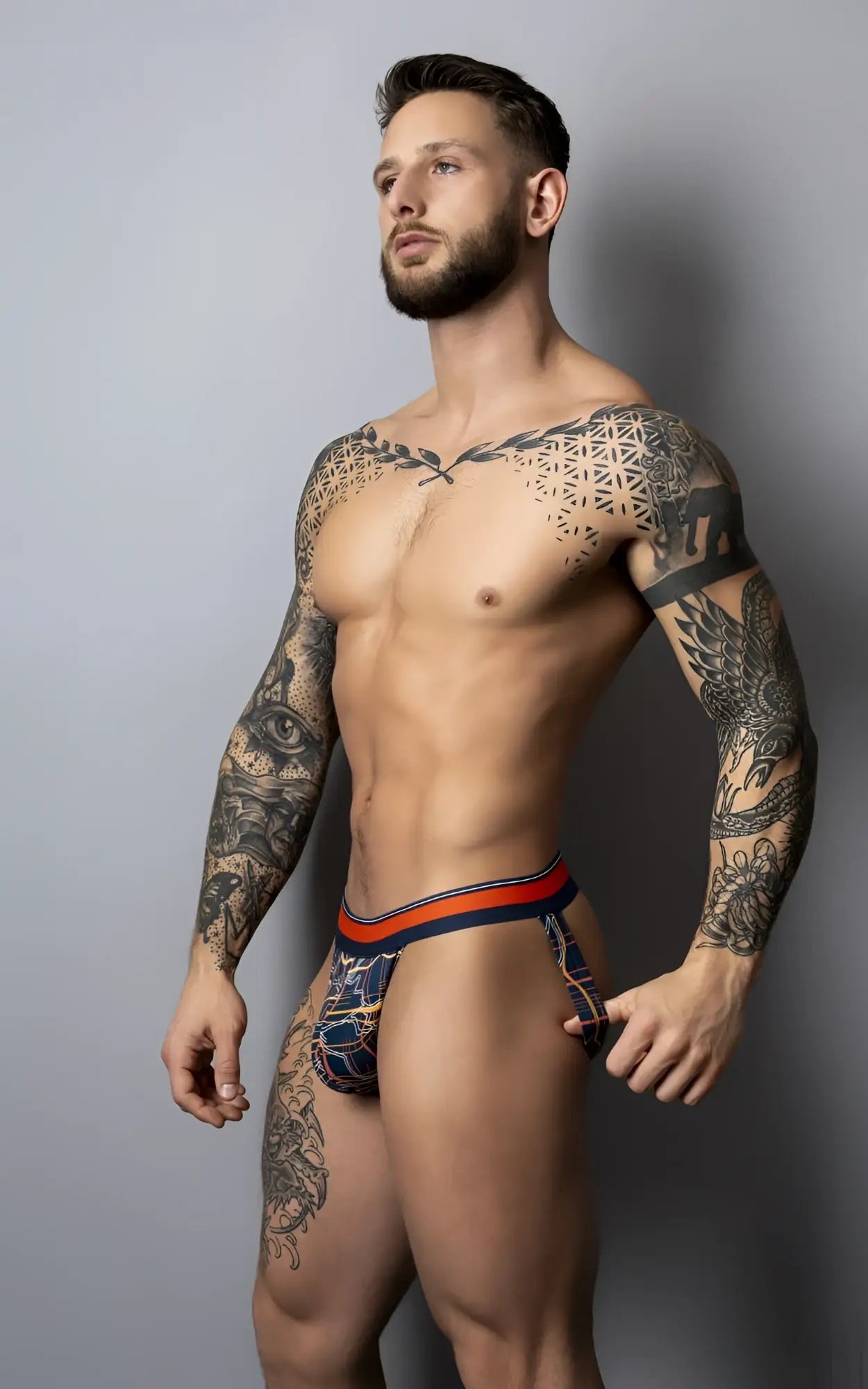 Male power 349-299 soo cumfy jockstrap in navy with blue and orange geometric patterned men’s briefs visible