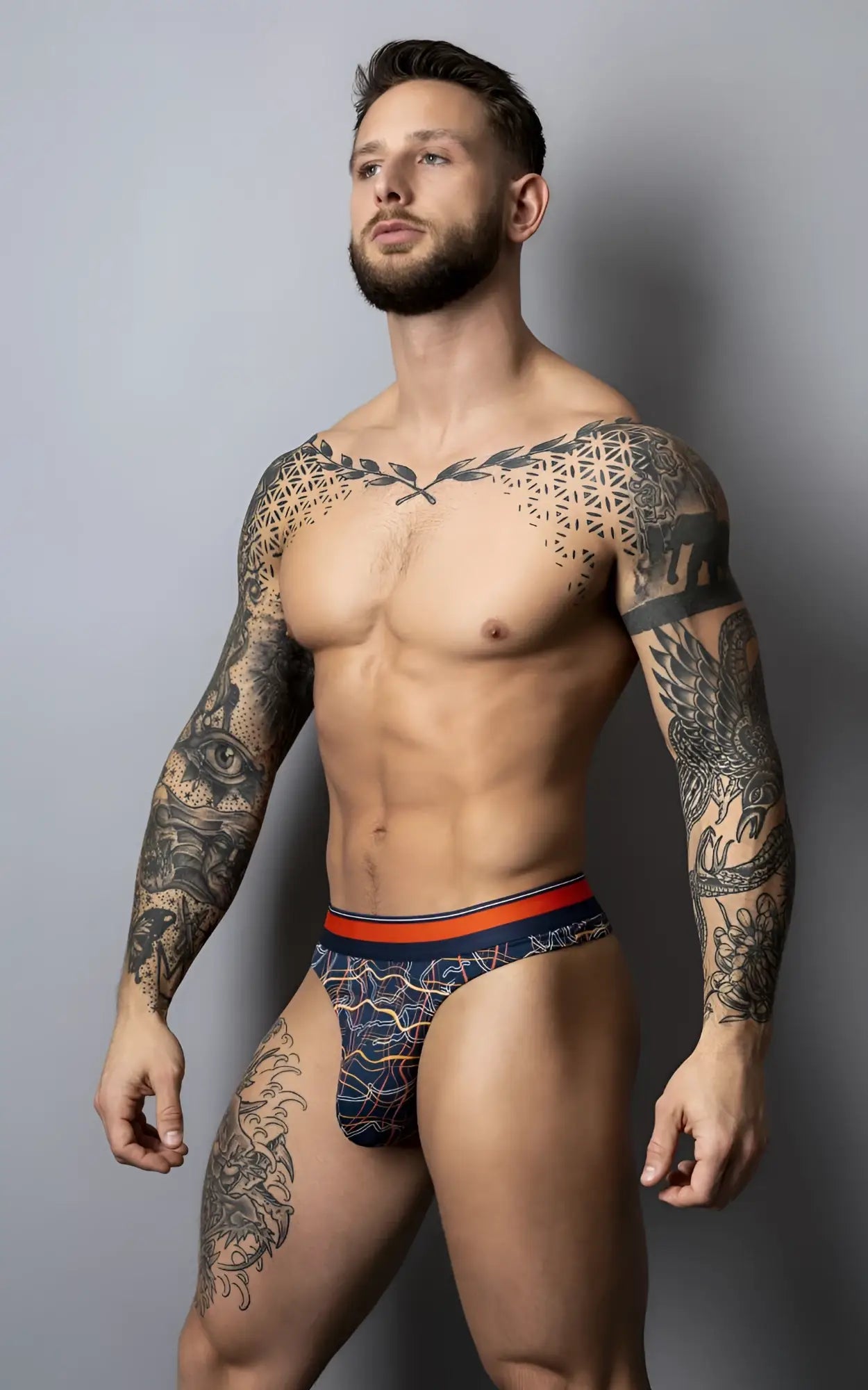 Navy blue patterned male power soo cumfy thong with orange waistband designed for comfortable wear