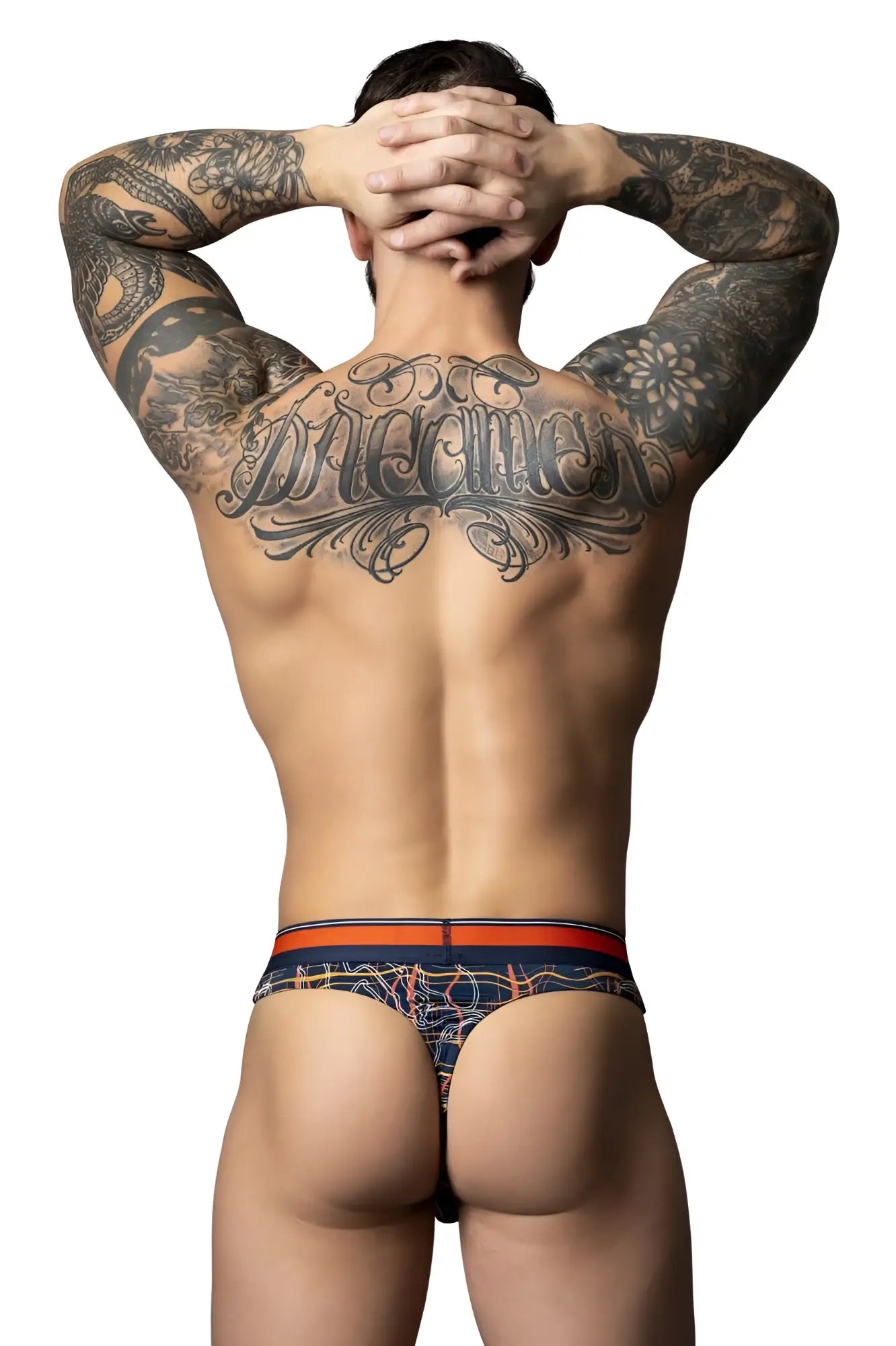 Men’s navy blue and orange patterned briefs with intricate designs from Male Power Soo Cumfy Thong collection