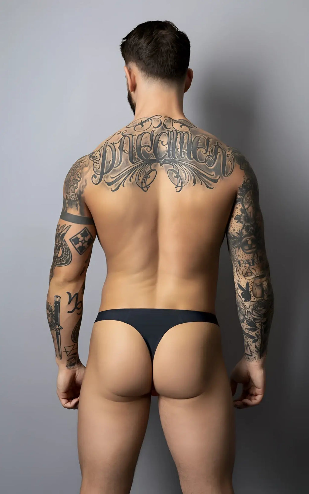 Male power 442-300 hot mesh thong in black and red with smooth, form-fitting design shown from the back side
