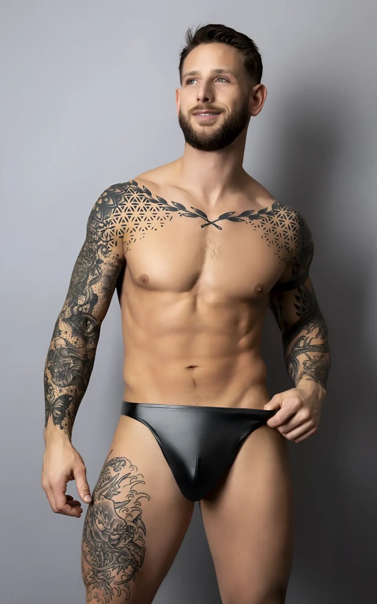 Male power 442-301 liquid onyx 2.0 black leather briefs shown from the back with a sleek thong design