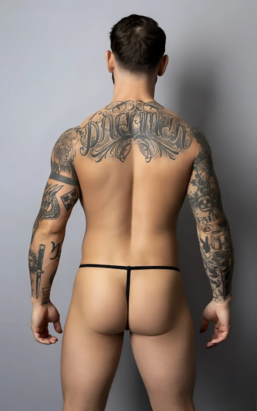 Male power 450-301 liquid onyx 2.0 g-string in blue with a minimalist black thong design shown from the back side