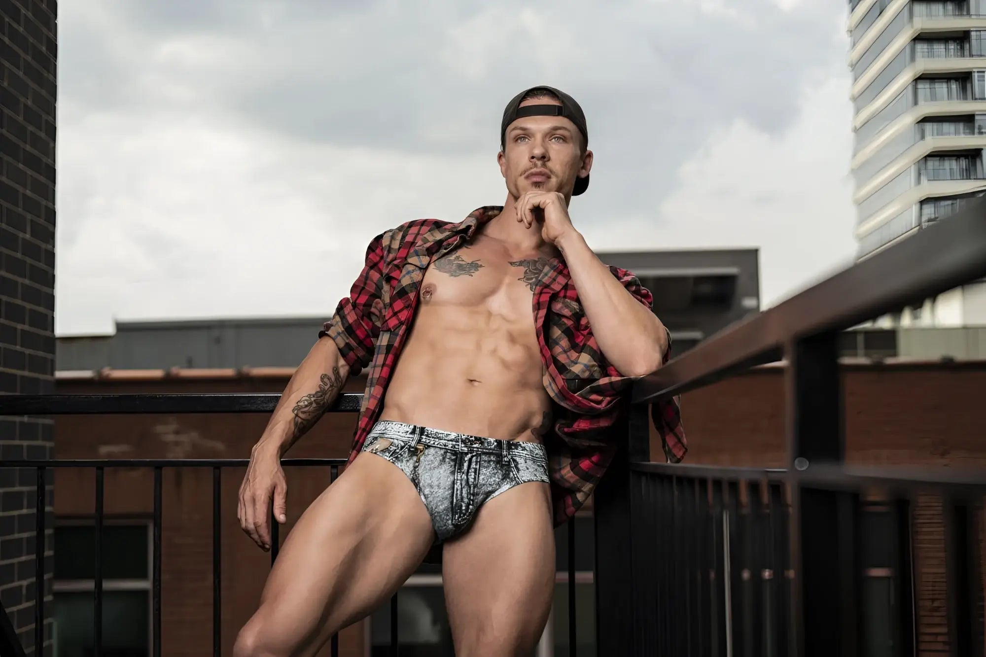 Denim-patterned briefs by male power with faded blue and white wash and subtle stitching details in denim print