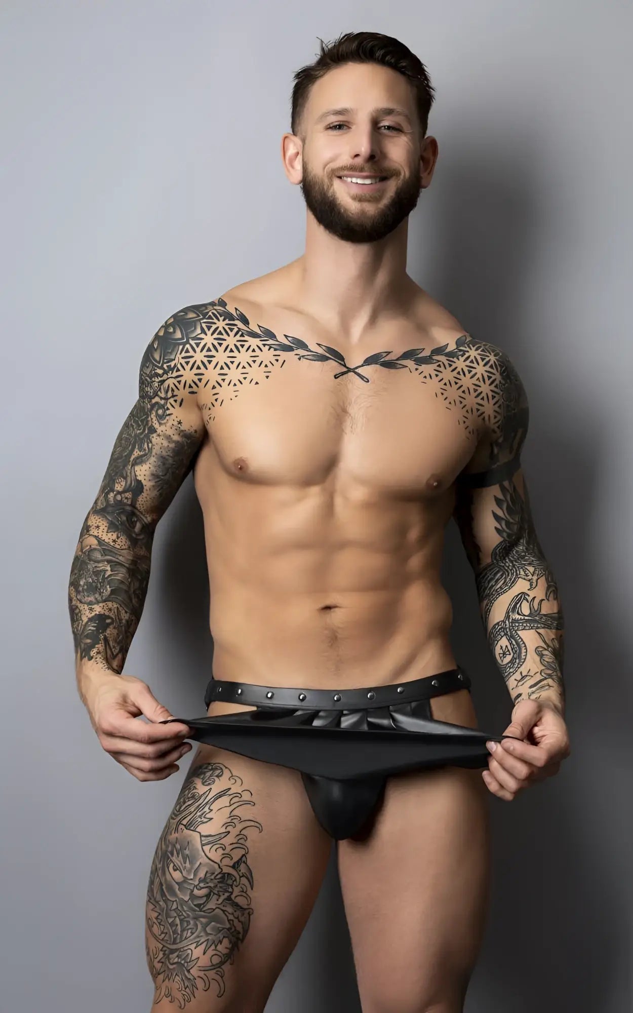 Black leather thong with studded belt detail from male power pak158 fetish spartacus in black showing front view