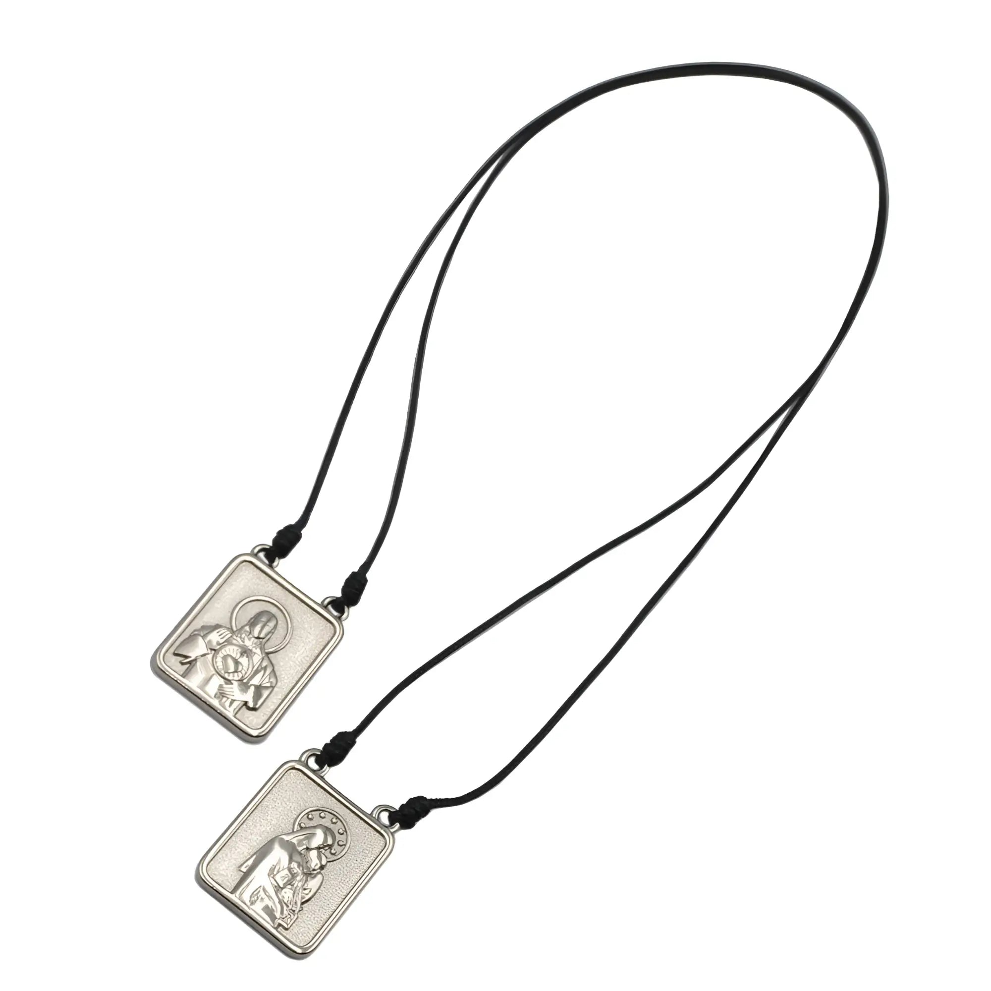 Silver rectangular male scapular pendant with embossed figure on black cord men’s jewelry necklace