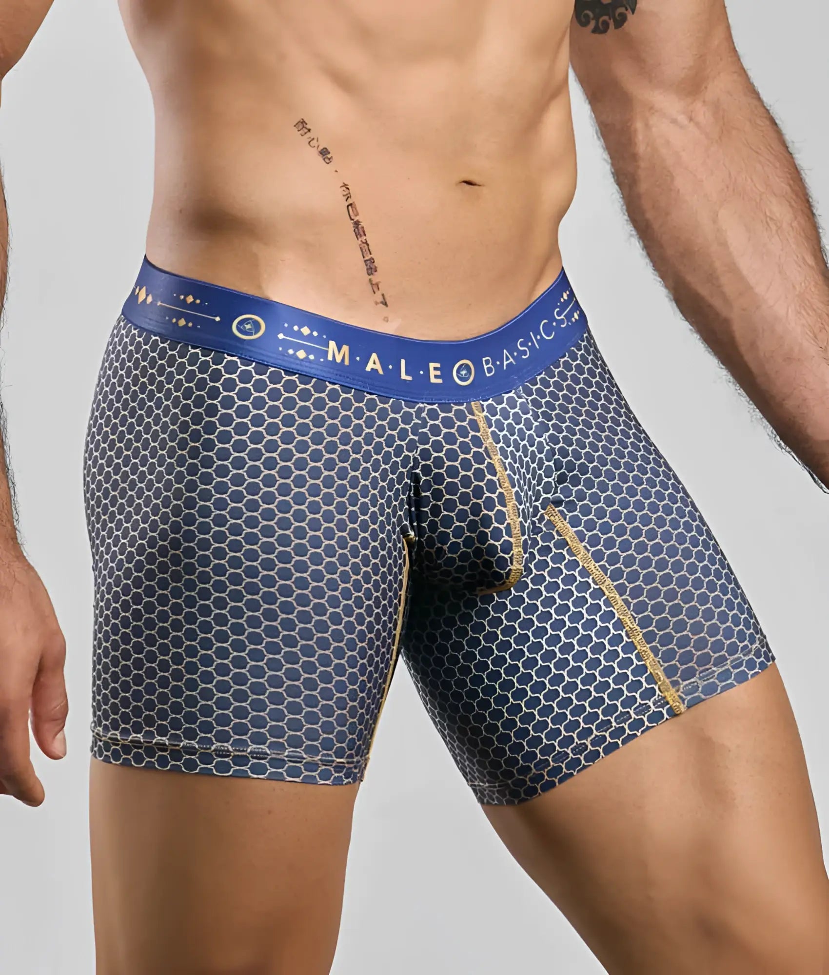 Blue honeycomb patterned men’s boxer briefs with gold trim and branded waistband from malebasics hipster collection