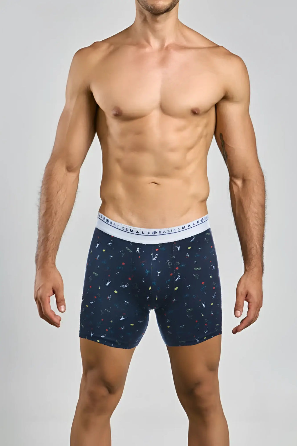 Navy blue malebasics boxerbrief party with colorful abstract pattern and white waistband featuring basics male text