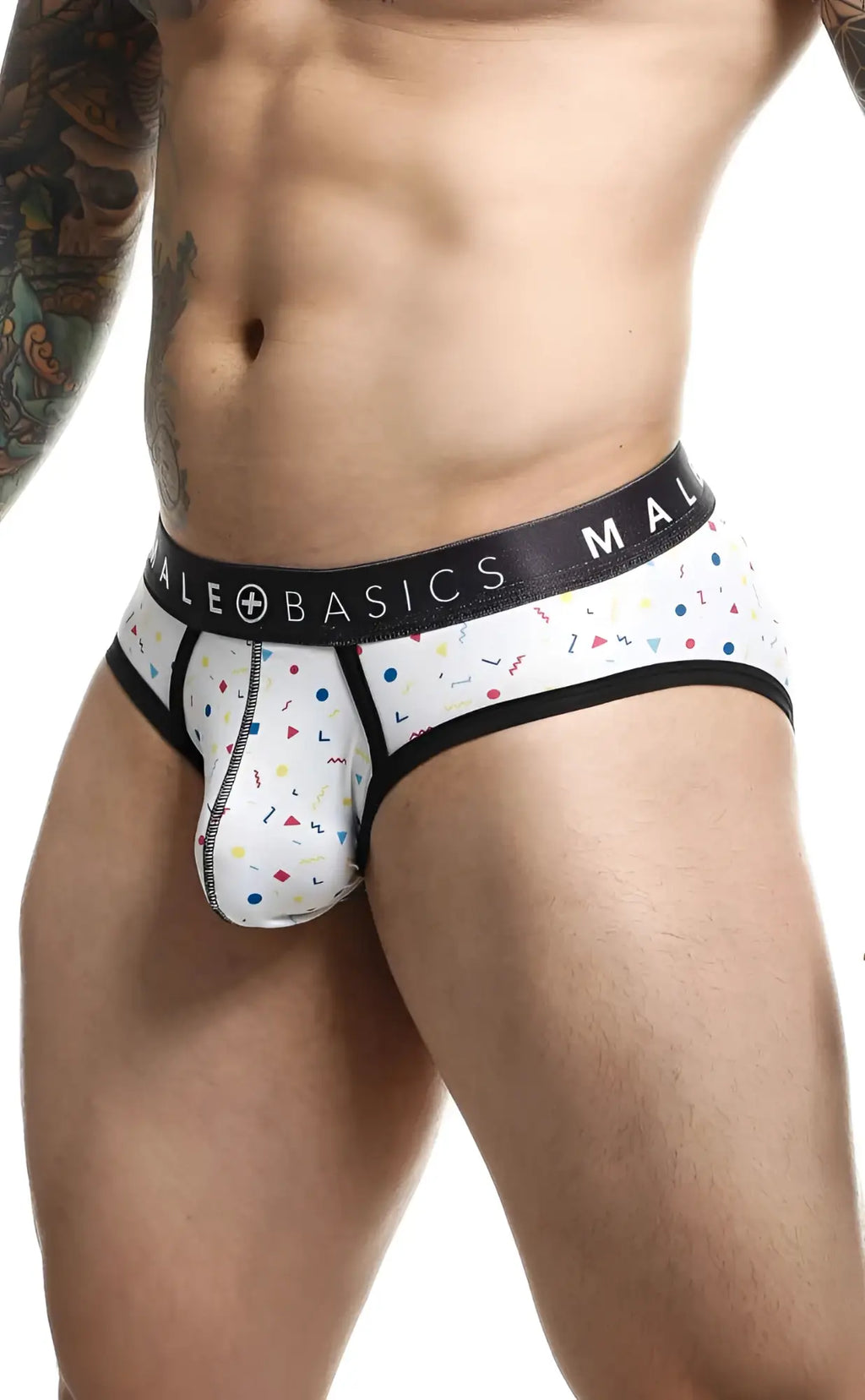 White men’s briefs with colorful confetti pattern black trim and malebasics brand on waistband malebasics brief sexy pouch