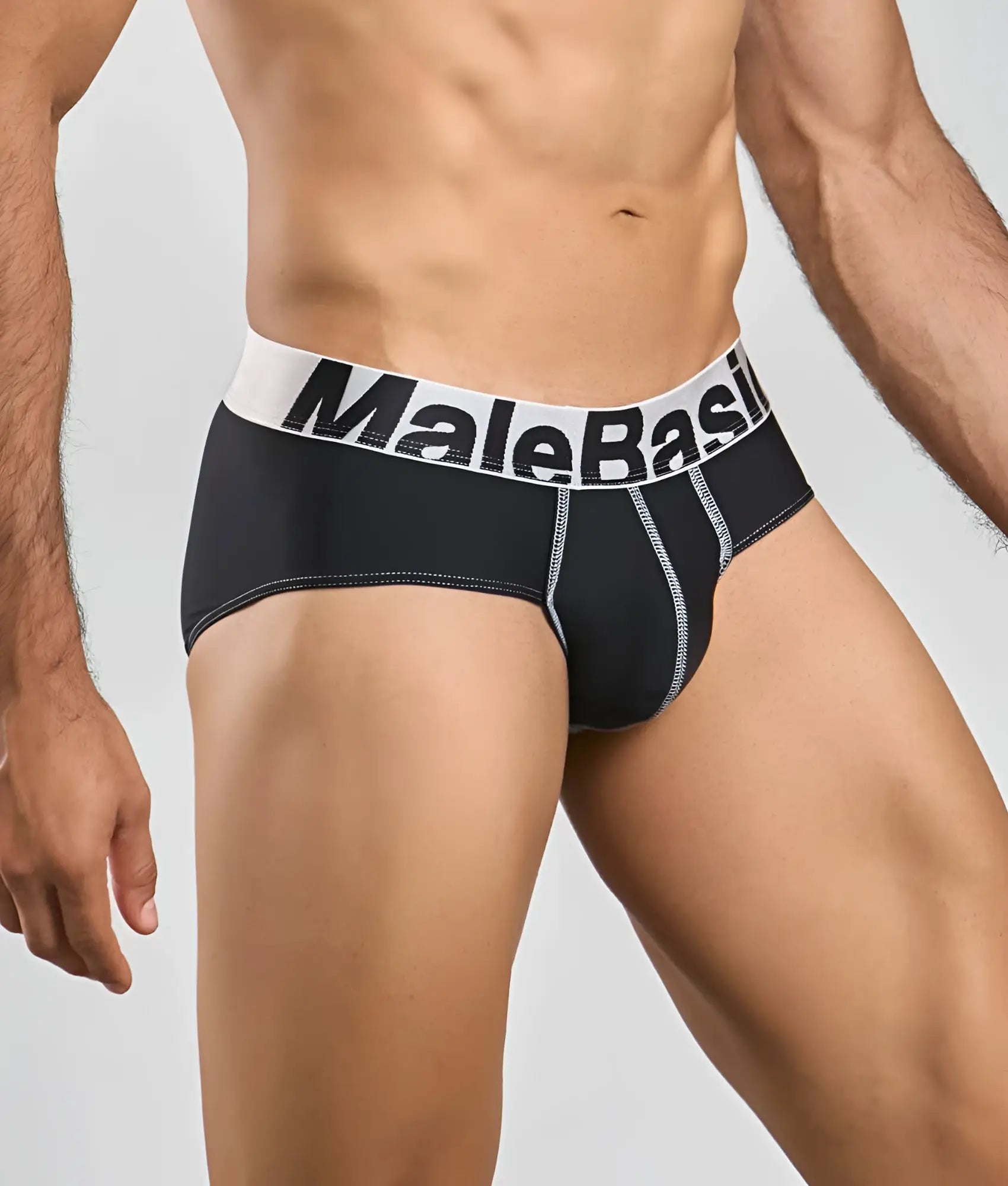 Black malebasics microfiber briefs with white waistband bold black lettering and silver stitching along seams back view
