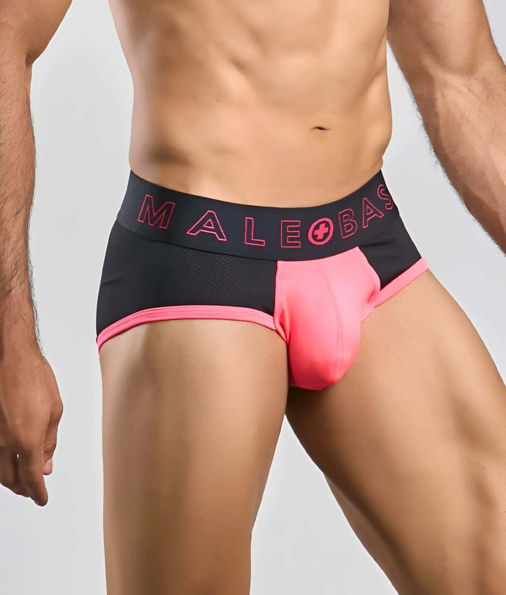 Black and pink malebasics neon brief with mesh waistband and bright pink male plus base logo designed for athletic use