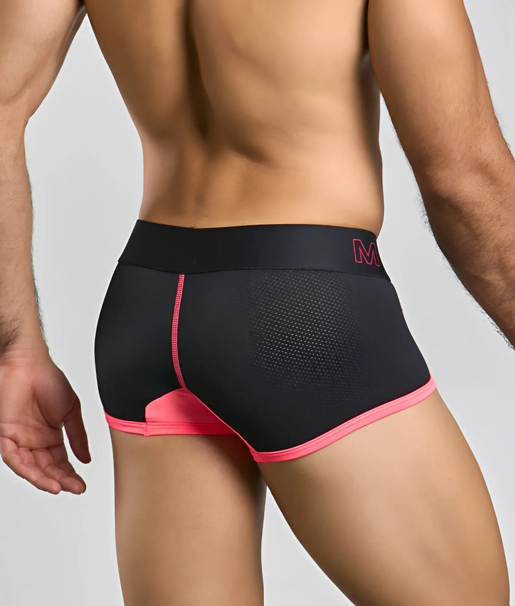 Malebasics neon trunk black athletic briefs with vibrant pink trim mesh detailing and subtle m logo on waistband