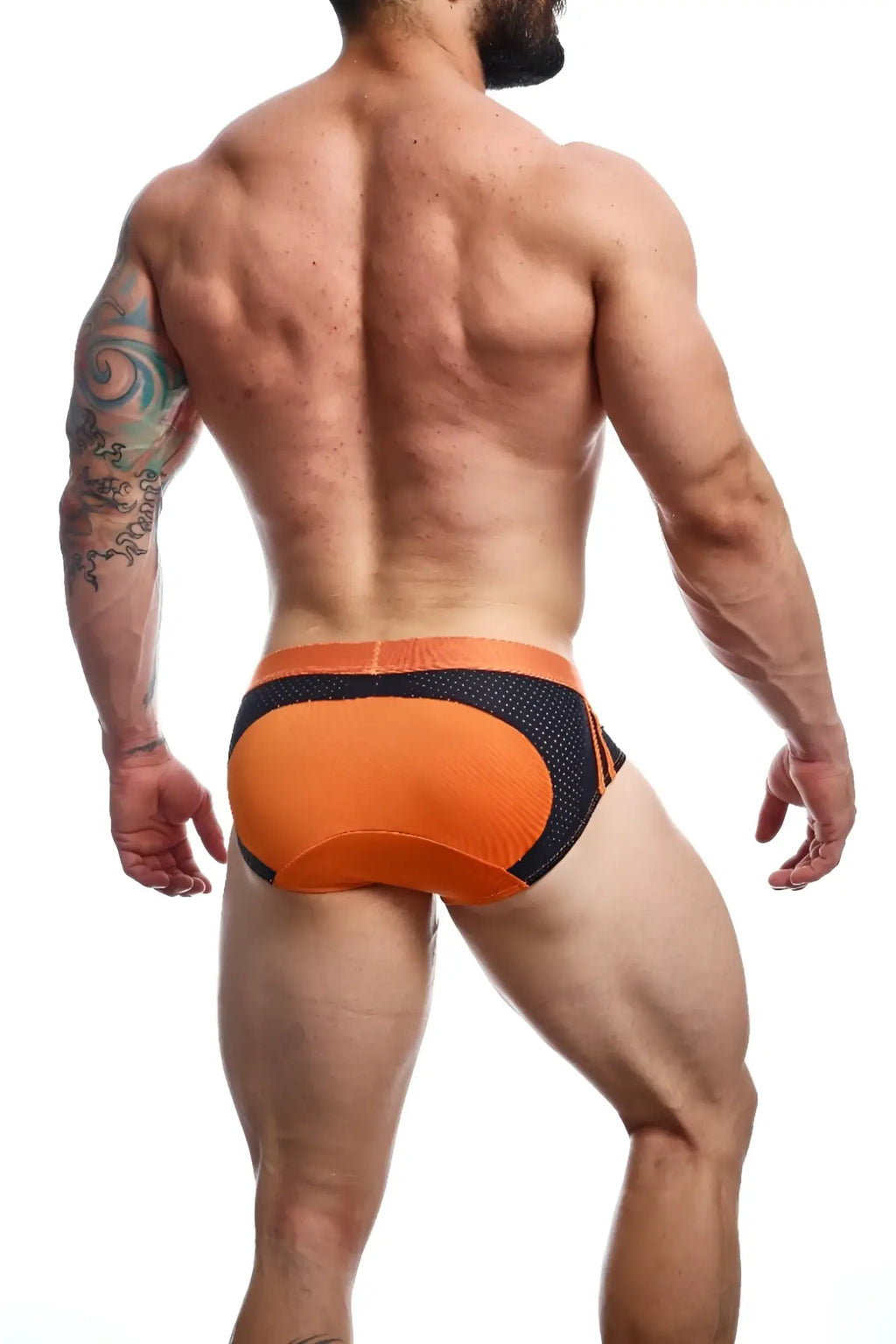 Malebasics spot brief in red featuring orange and black mesh swim trunks with contoured design front view
