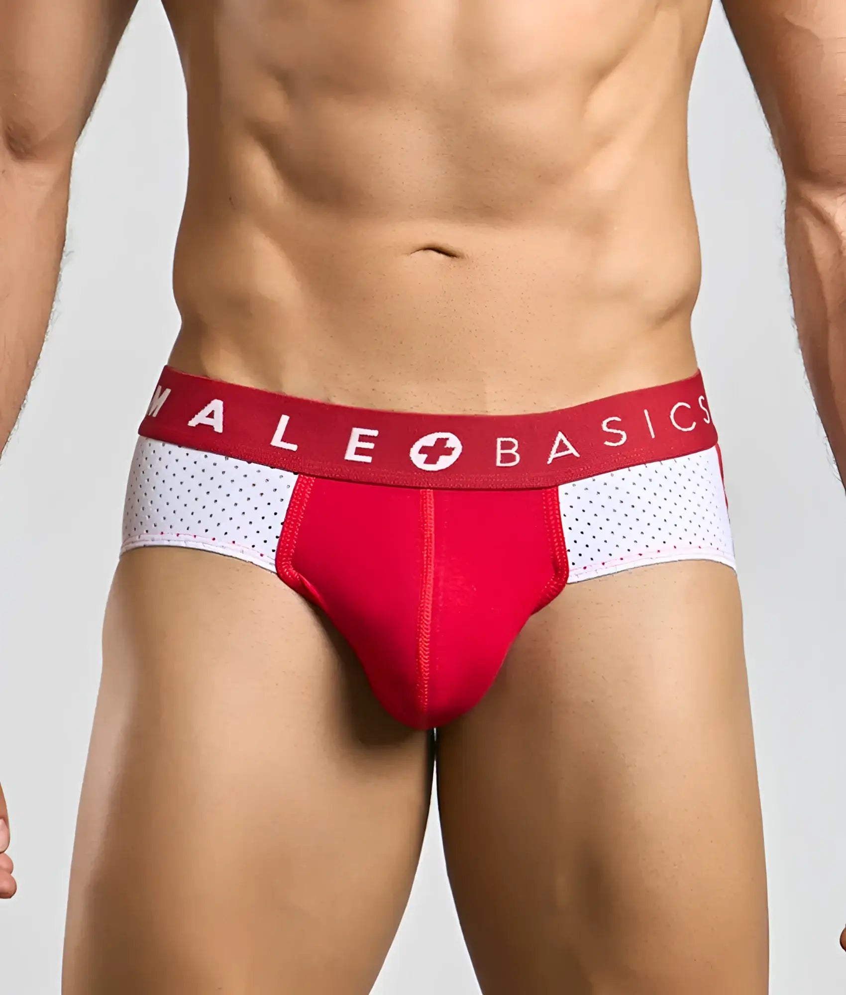 Red and white male basics spot brief with perforated design offers breathable comfort and sleek style