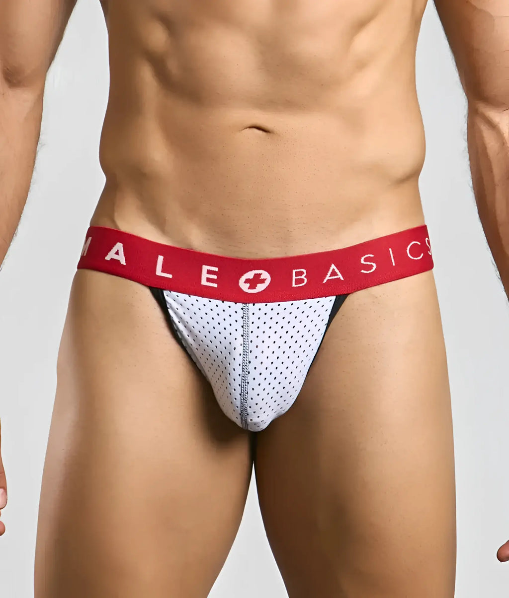 Malebasics spot jockstrap in white mesh briefs with red waistband and male basics logo featuring white cross symbol