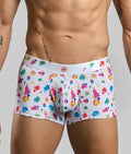 White boxer briefs with vibrant multicolored paint splatter pattern and red cross logo on waistband malebasics trunk hipster white splash