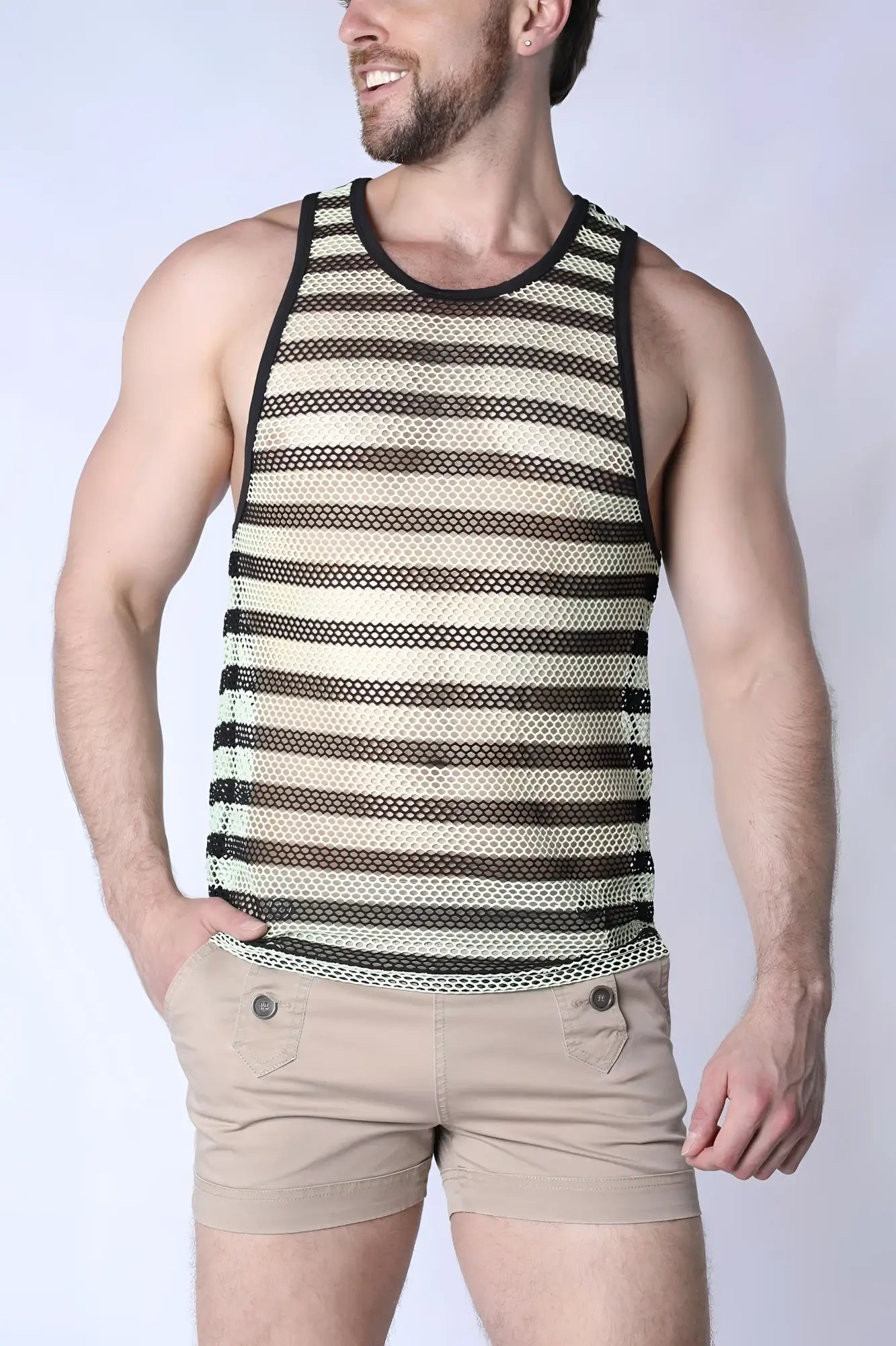 A man wearing a black and cream striped mariner mesh stripe tank top with a round neckline