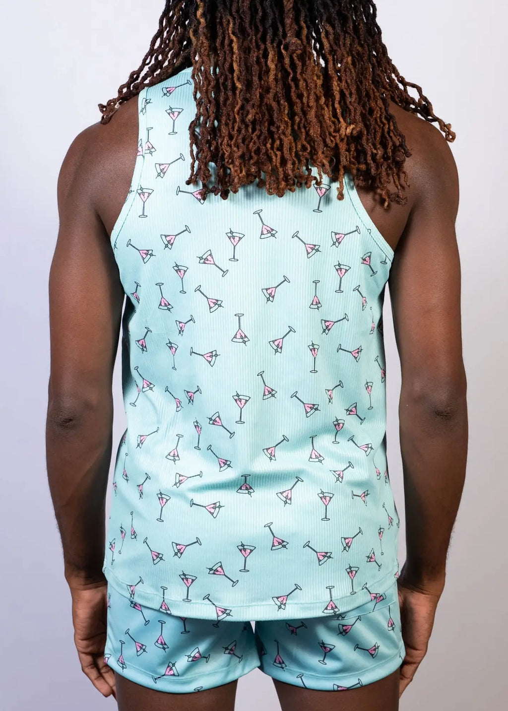 Light blue martini print tank top with pink and black glass pattern for casual summer wear