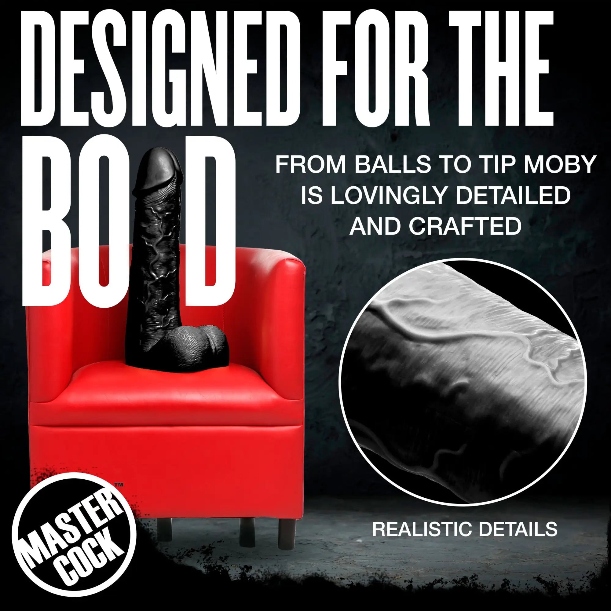 Master Cock Black Moby, a large, realistic black dildo with detailed texture sitting on a bright red armchair.
